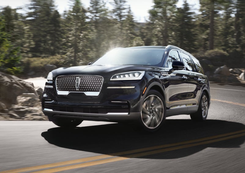 A Lincoln Aviator® SUV is being driven on a winding mountain road | Fair Oaks Lincoln in Naperville IL