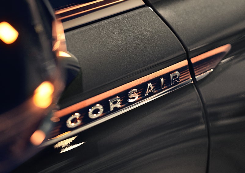 The stylish chrome badge reading “CORSAIR” is shown on the exterior of the vehicle. | Fair Oaks Lincoln in Naperville IL