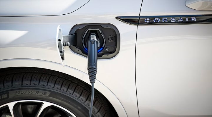 An electric charger is shown plugged into the charging port of a Lincoln Corsair® Grand Touring
model. | Fair Oaks Lincoln in Naperville IL