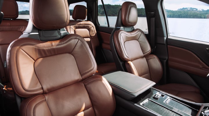 The front row's Perfect Position Seats in a 2024 Lincoln Aviator® Reserve model with Ebony Roast interior | Fair Oaks Lincoln in Naperville IL