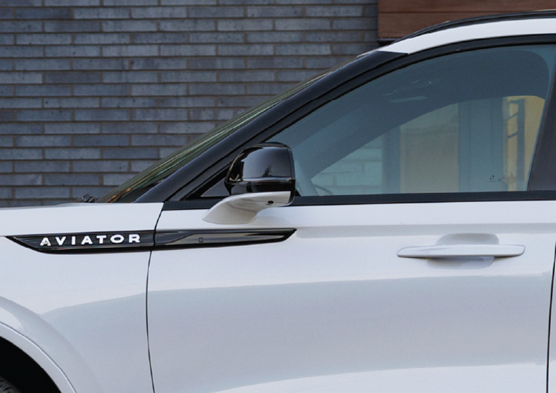 The driver’s door of a white 2025 Lincoln Aviator® SUV is showcased. | Fair Oaks Lincoln in Naperville IL