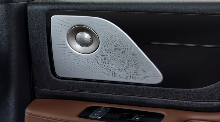 A close-up of a speaker located on the door’s interior is shown. | Fair Oaks Lincoln in Naperville IL