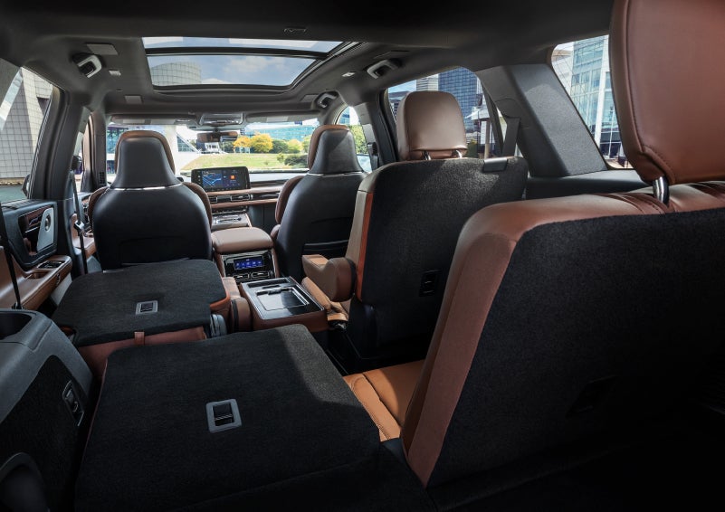 The interior of the 2025 Lincoln Aviator® SUV is shown with two seats folded down for added space. | Fair Oaks Lincoln in Naperville IL