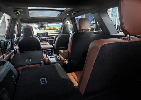 The interior of the 2025 Lincoln Aviator® SUV is shown with two seats folded down for added space. | Fair Oaks Lincoln in Naperville IL