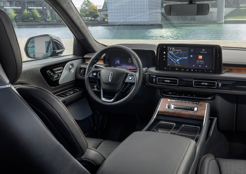 The interior of the 2025 Lincoln Aviator® SUV is shown parked with a view of a harbor through the windshield. | Fair Oaks Lincoln in Naperville IL