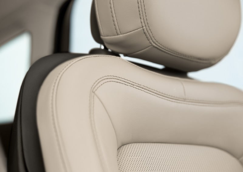 Fine craftsmanship is shown through a detailed image of front-seat stitching.