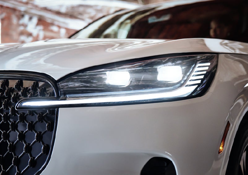 A close-up of a headlamp on the 2026 Lincoln Aviator® SUV is shown. | Fair Oaks Lincoln in Naperville IL
