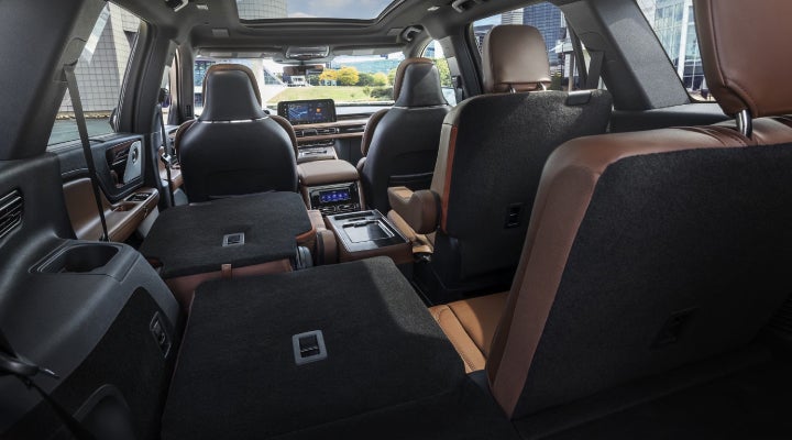 One side of the PowerFold® third-row seat and a second-row seat are folded forward in the 2026 Lincoln Aviator® SUV. | Fair Oaks Lincoln in Naperville IL