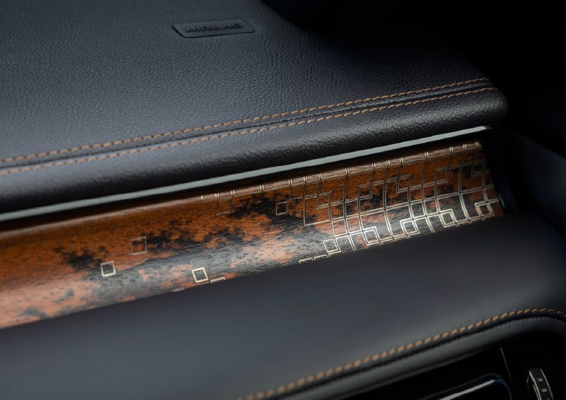 A close-up shot of the 2026 Lincoln Aviator® dashboard with unique black and brown accents and brown stitching. | Fair Oaks Lincoln in Naperville IL