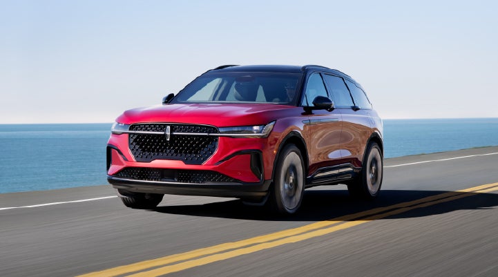 A 2026 Lincoln Nautilus® SUV is being driven on a seaside roadway. | Fair Oaks Lincoln in Naperville IL