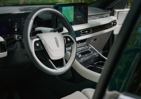 The leather-trimmed steering wheel of a 2027 Lincoln Aviator® Black Label™ SUV. | Fair Oaks Lincoln in Naperville IL
